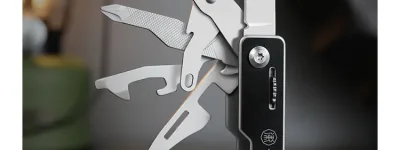 WETACTICS 6-in-1 keychain tool with deployed scissors and phone stand