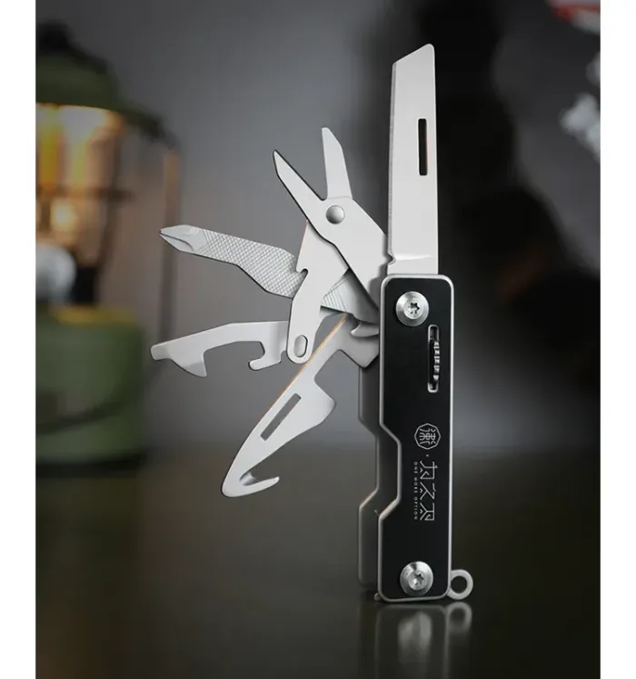 WETACTICS 6-in-1 keychain tool with deployed scissors and phone stand