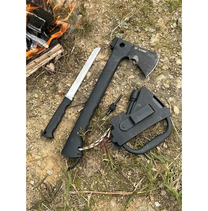 WETACTICS 6-in-1 survival axe demonstrating fire starting and wood chopping